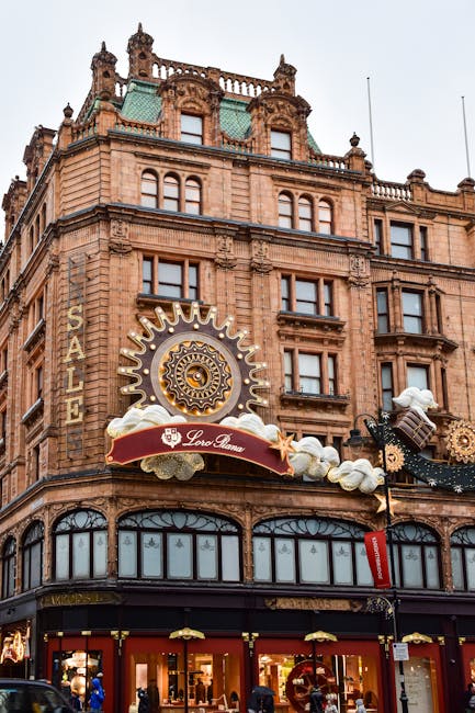The exterior of a historic, multi-story building in Knightsbridge featuring detailed architectural elements such as ornate window frames, decorative cornices, and a prominent clock face surrounded by